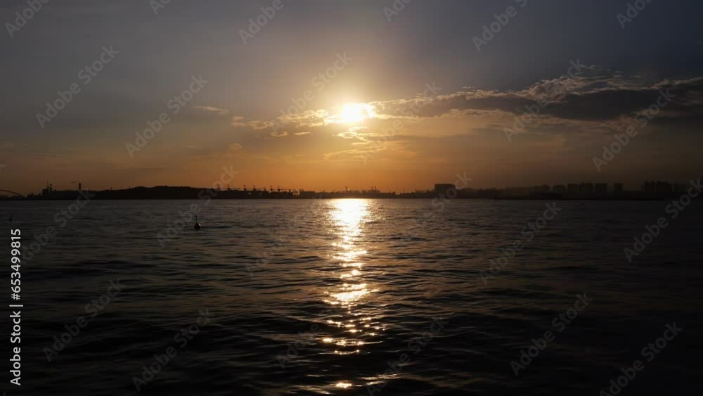 Beautiful scenery of Tokyo Bay with the setting sun reflecting off the surface of the sea. Beautiful scenery of Tokyo Bay with the setting sun reflecting off the surface of the sea.
