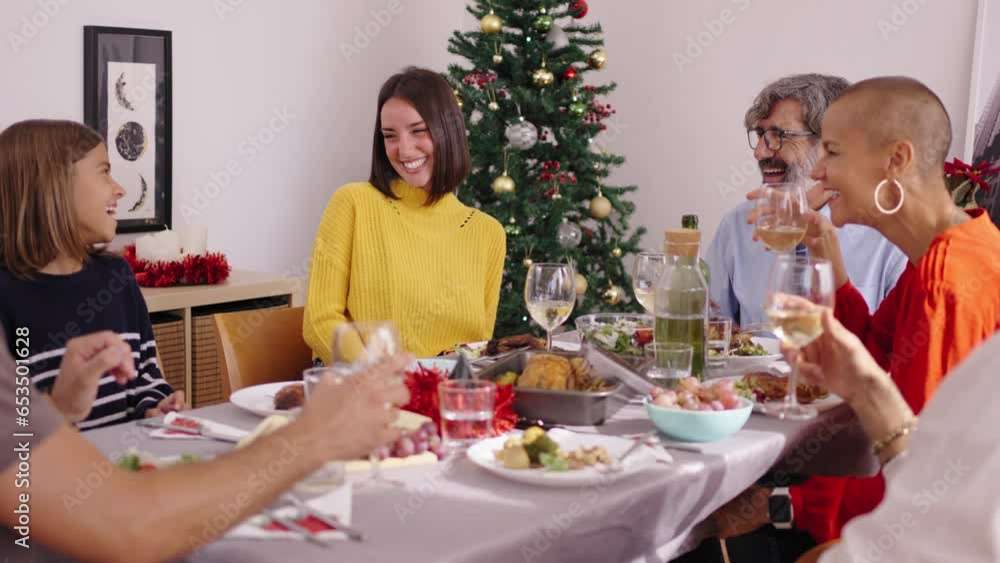 Laughing Caucasian family gathering celebrating Christmas vacations at festive table. People eating funny together at home on Thanksgiving Day. Three European generations enjoying domestic life. Laughing Caucasian family gathering celebrating Christmas vacations at festive table. People eating funny together at home on Thanksgiving Day. Three European generations enjoying domestic life.