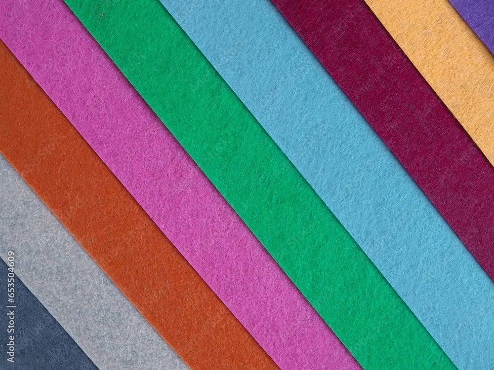 Fototapeta premium Colorful background, A stack of colorful fabric. Full frame shot of muti colored fabric background