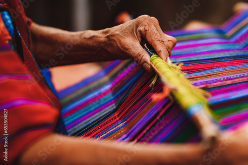 Close up shot of Guatemalan handcraft textile and colorful patterns made by indigenous woman