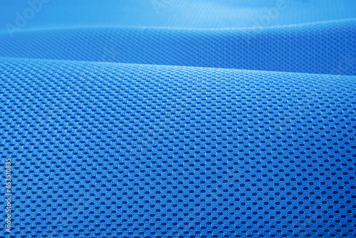 Rough blue fabric texture, cotton knitted fabric, modern waterproof flexible temperature control materials, multifunctional smart textile close-up, selective focus, does not tear