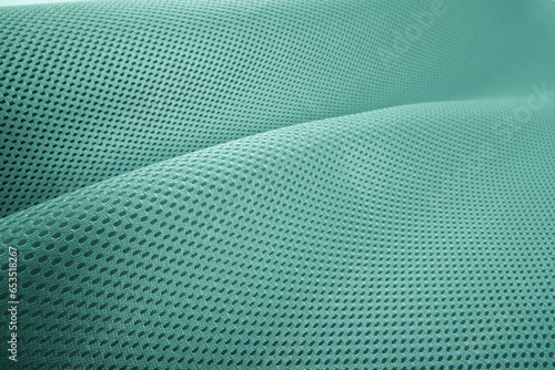 Rough pool green fabric texture, cotton knitted fabric, modern waterproof flexible temperature control materials, multifunctional smart textile close-up, selective focus, does not tear