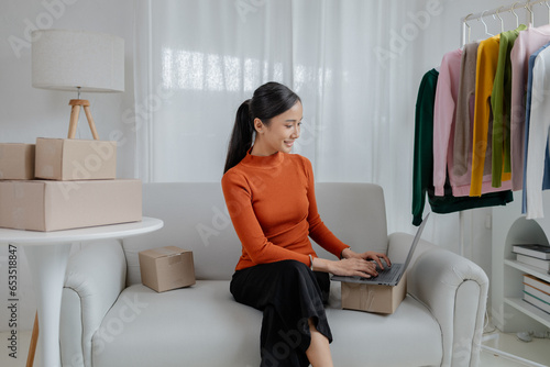 Asian women own design and tailoring shops, women's clothing business owners, sell clothes online on websites and do live sales via social media. Business ideas for selling clothes and selling online.