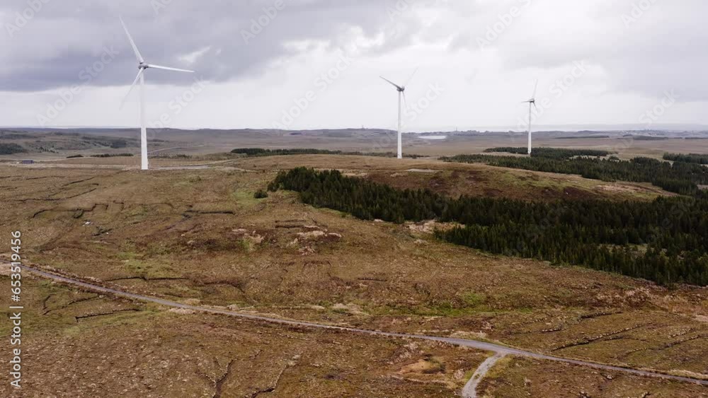 Drone shot of a wind farm operating on the Western Isles of Scotland. Drone shot of a wind farm operating on the Western Isles of Scotland.