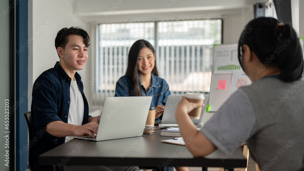 A group of Asian startup businesspeople are discussing a new project in the meeting room together. A group of Asian startup businesspeople are discussing a new project in the meeting room together.