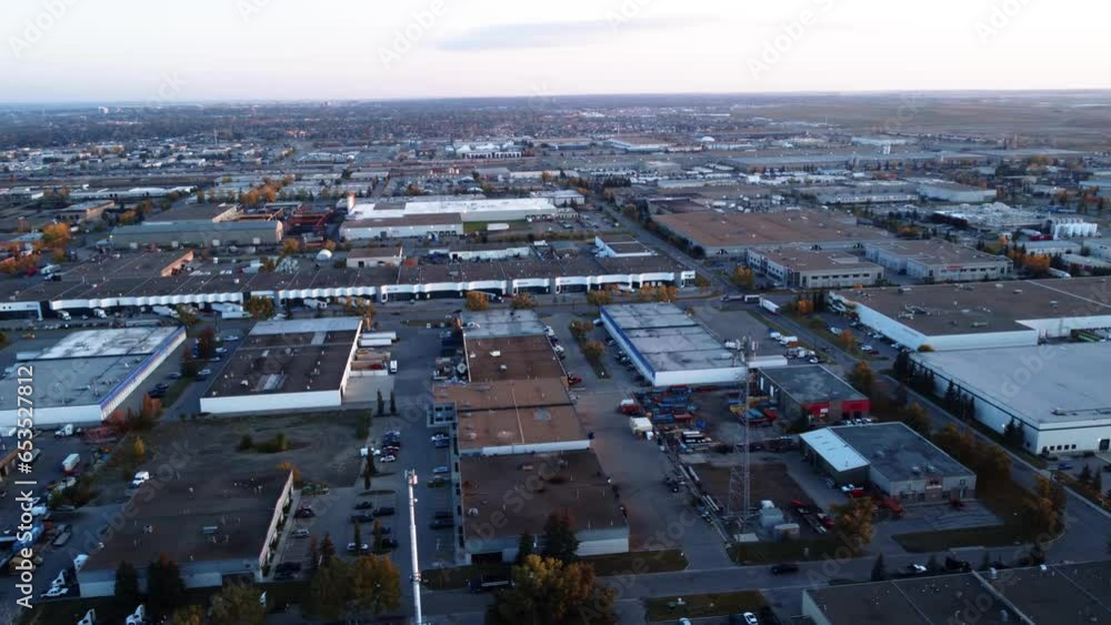 Circular drone shot in Calgary industrial zone at sunrise. Circular drone shot in Calgary industrial zone at sunrise.