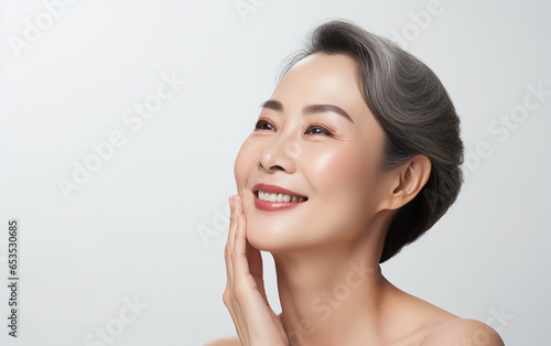 Mature senior asian woman with beauty and healthy face skin portrait isolated on white background
