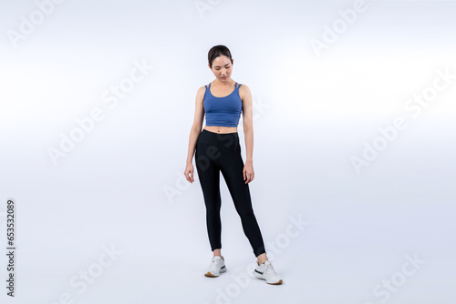 Full body asian woman in sportswear portrait, smiling and posing cheerful gesture. Workout training with attractive girl engage in her pursuit of healthy lifestyle. Isolated background Vigorous © Summit Art Creations