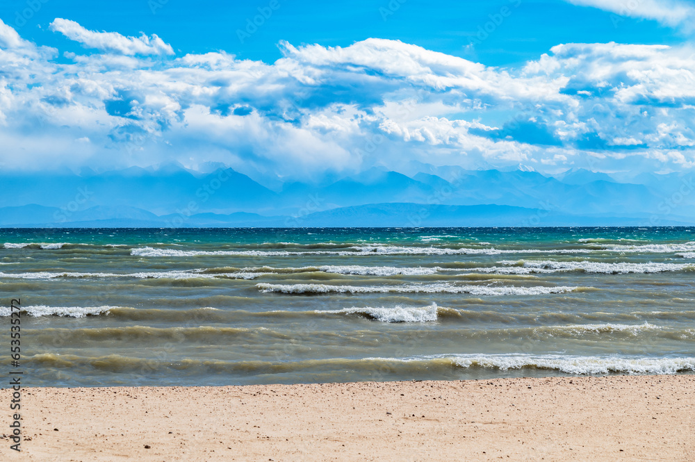 Thunderclouds over Issyk-Kul. Beautiful waves on the lake.