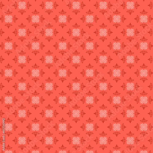 Simple botanical pattern with red leaves and white geometric openwork motifs lying on a light red-pink background