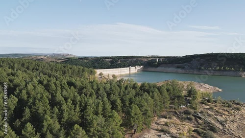 Wallpaper Mural Aerial view of a hydroelectric dam surrounded by a reservoir and pine trees on the shore. Aguilar de Campoo Reservoir Torontodigital.ca