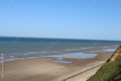 Sandy Beach with wooden breakwaters
