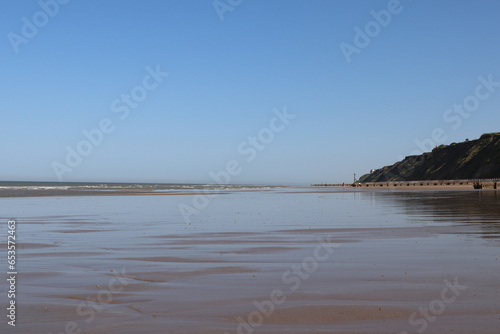 Sandy Beach with wooden breakwaters