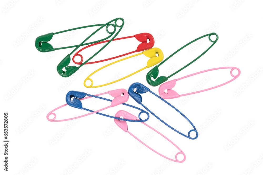 Multicolor safety pins isolated on white background. lots of colorful pins closeup Multicolor safety pins isolated on white background. lots of colorful pins closeup
