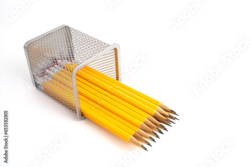 Pen holder full of pencils on isolated background