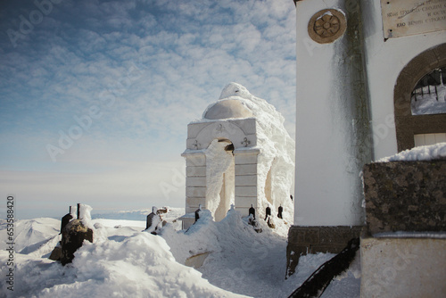Frozen chapel on the peak of the mountain Voras winter Greece kaimaktsalan v3