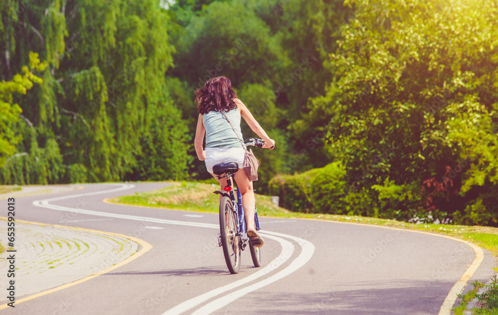 Cyclist ride on the bike path in the city Park
