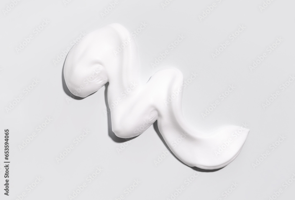 texture foam mousse foam cosmetic smear sample on a light background texture foam mousse foam cosmetic smear sample on a light background