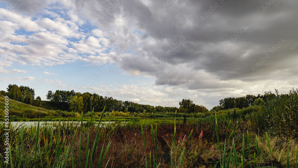 Fototapeta premium clouds over the river