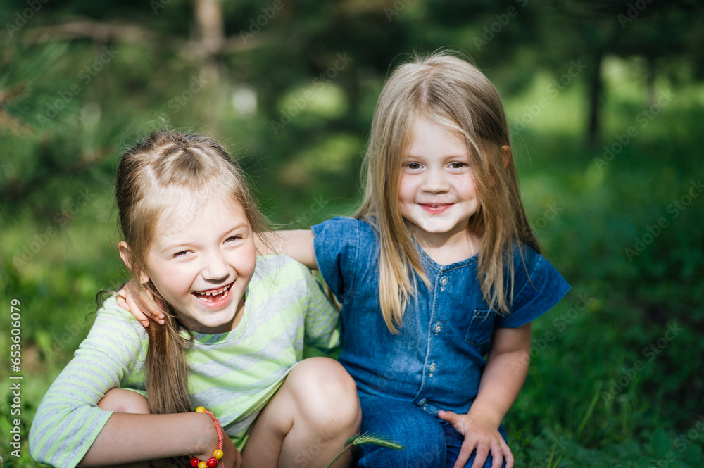 sisters' love. happy children. happiness on the faces of little people. friendship sisters' love. happy children. happiness on the faces of little people. friendship