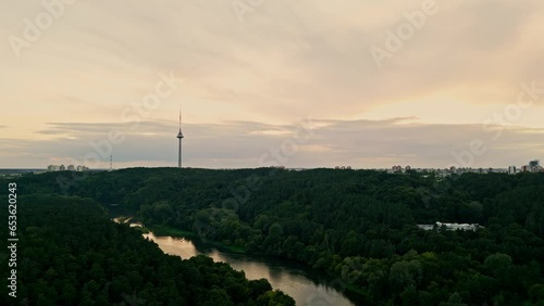 The drone takes off over the park. View of the city and the TV tower. Vilnius, Lithuania