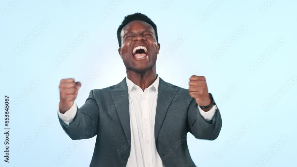 Black man in business, celebration and cheers with fist pump for job promotion and winning on blue background. Excited, happiness and yes with winner in portrait, reward for target success in studio Black man in business, celebration and cheers with fist pump for job promotion and winning on blue background. Excited, happiness and yes with winner in portrait, reward for target success in studio