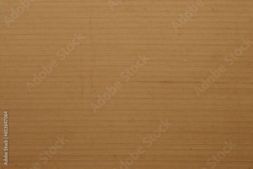 This brown corrugated cardboard sheet is useful as a background with copy space.Generative AI
