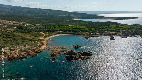 The rocky and sandy beach of Di Cala in the north-west of Sardinia. Drone photos taken on a sunny day.
