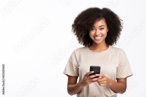 Woman with curly hair happily edits photo from dating app on mobile phone isolated on white background.