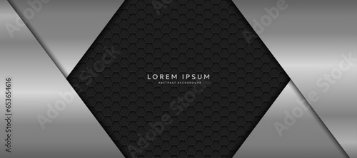 The dark background consists of reflective metallic lines. hexagonal metal texture background