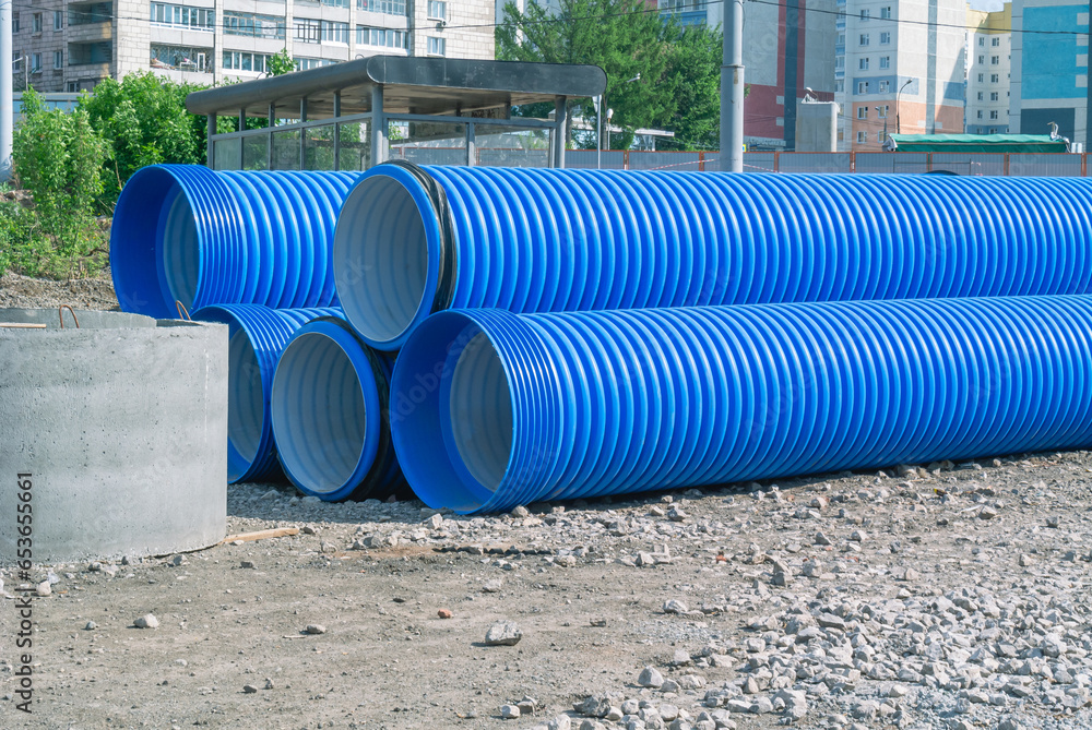 Blue plastic drain pipe with thread. Corrugated sewer pipes of large