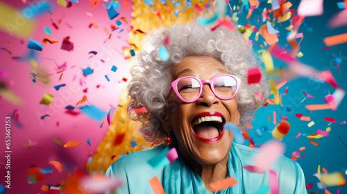Happy laughing woman with falling confetti. Birthday  New Year  fun celebration party