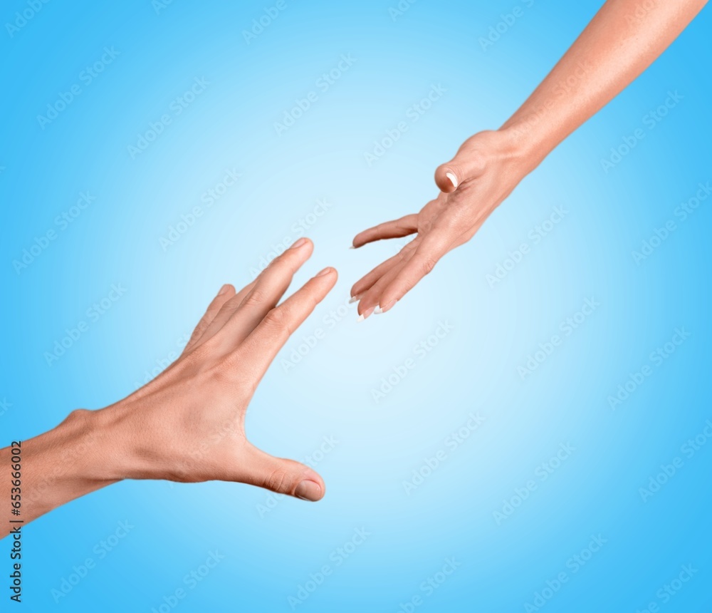 Hands reaching to help trying to touch