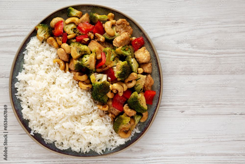 Homemade Cashew Chicken Stir-Fry on a Plate, top view. Flat lay, overhead, from above. Copy space. Homemade Cashew Chicken Stir-Fry on a Plate, top view. Flat lay, overhead, from above. Copy space.