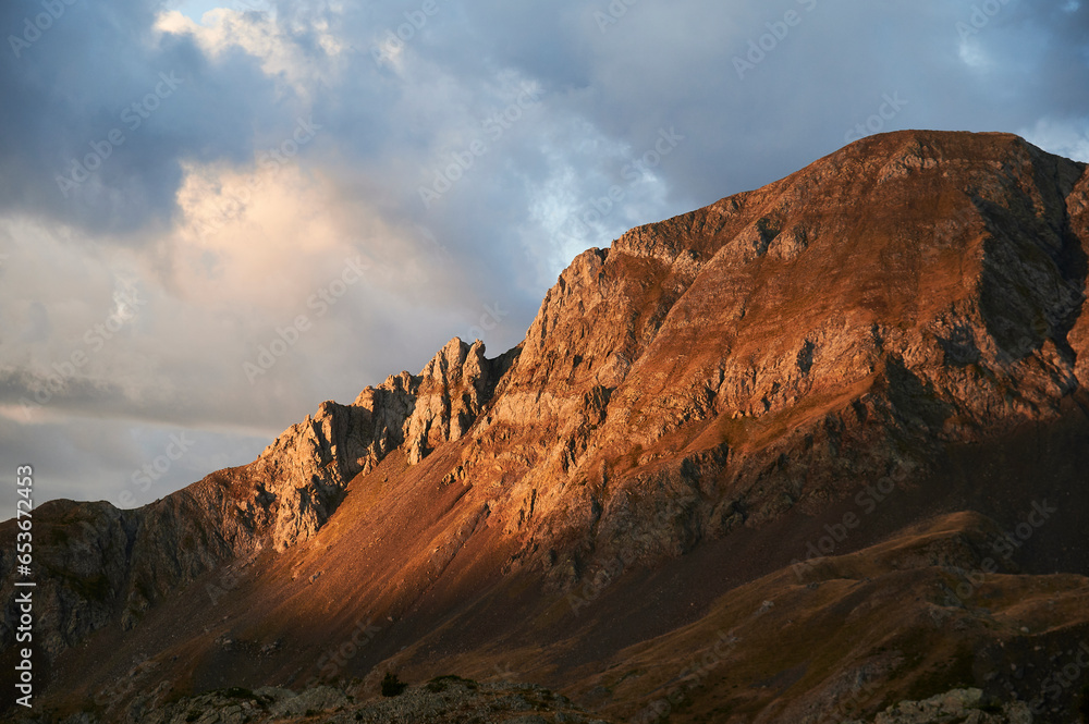 Rough rocky Garmo Negro mountain peak against blue sky Rough rocky Garmo Negro mountain peak against blue sky