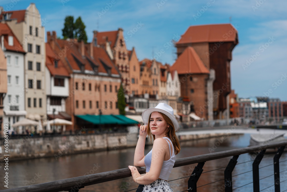 girl in a white hat on the background of the city of Gdansk Poland Europe