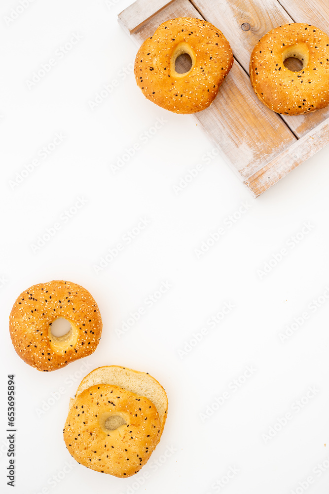 Homemade baked bread bagels on wooden board. Healthy breakfast background Homemade baked bread bagels on wooden board. Healthy breakfast background