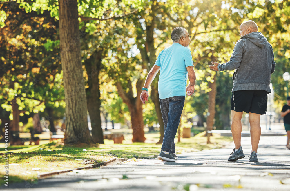 Obraz premium Fitness, walking and elderly men in park for wellness, healthy body and wellbeing in retirement, Friends, happy and mature people with smile, laugh and talk outdoors for exercise, workout and sports
