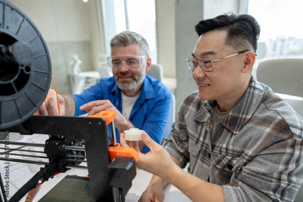 Scientists involved in setting up and developing 3D printers in the modern laboratory. Scientists involved in setting up and developing 3D printers in the modern laboratory.