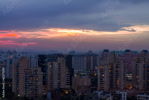 Wallpaper Mural Gurugram,Haryana,India urban cityscape with modern architecture,luxury residential and commercial buildings.Aerial view of Gurgaon skyline at sunset. Torontodigital.ca