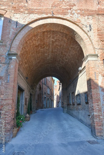 An ancient entrance arch in Torrita di Siena, a medieval town in Tuscany. photo