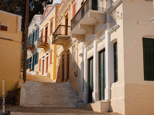 Symi Island  Greece islands holidays from Rhodos in Aegean Sea. Colorful neoclassical houses in bay of Symi. Holiday travel background. beautiful narrow street from the hill among cute Greek houses