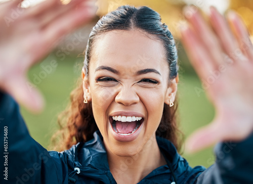 Selfie, face and an excited woman with energy outdoor for freedom or wellness on a blurred background in nature. Portrait, travel and adventure with a happy young person looking positive in summer