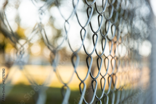 close up of chain link fence at a soccer club photo