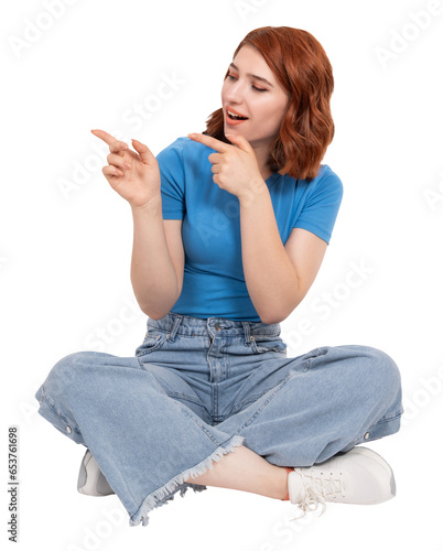 Obraz na plátne Point away aside with both fore fingers,  full body view caucasian red bob hair young woman point away aside with both fore fingers