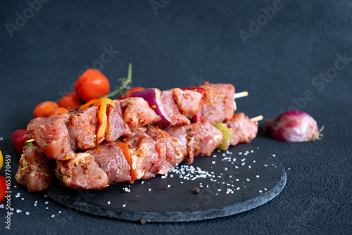 Beautiful meat with vegetables on wooden sticks.