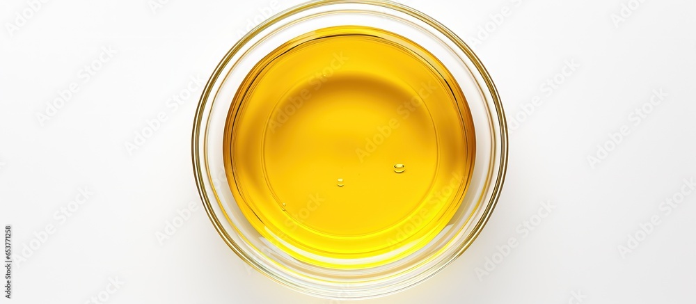 Isolated view of cooking oil in glass bowl Isolated view of cooking oil in glass bowl
