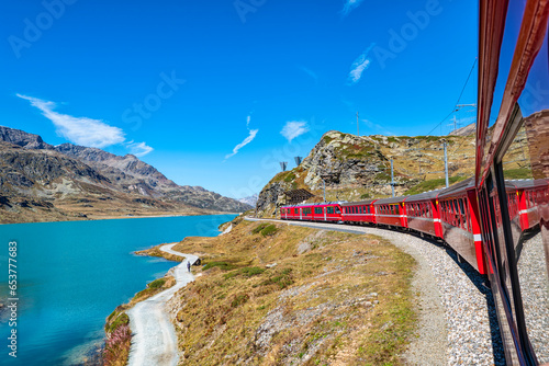 Red train of Bernina in the Swiss alps photo