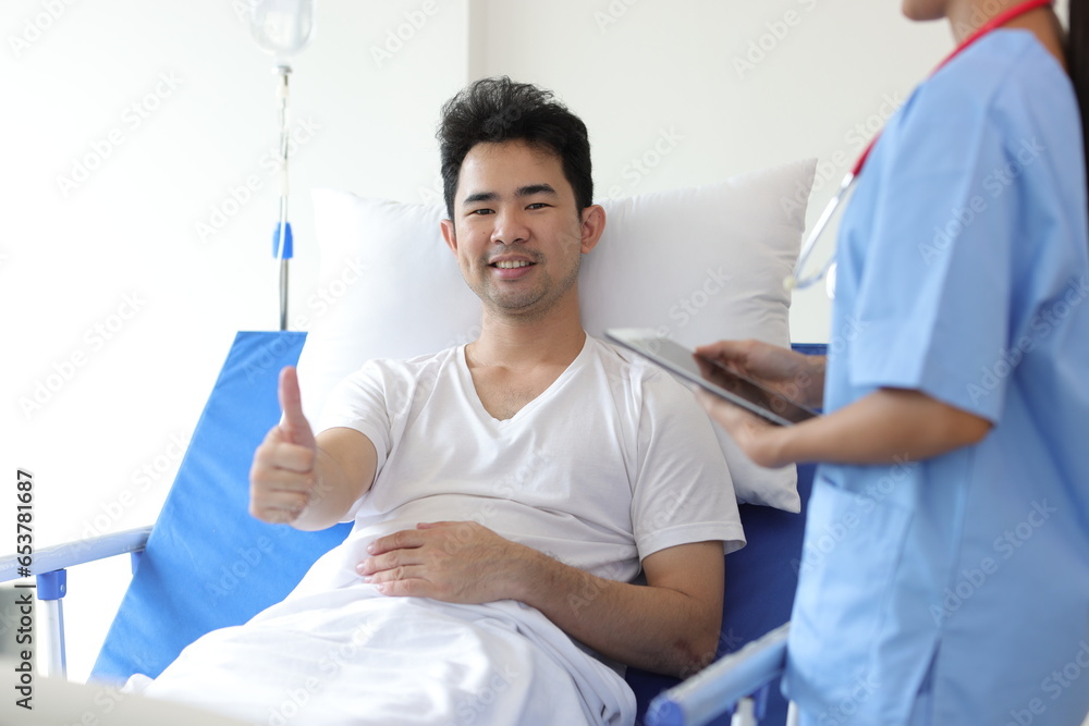Portrait of a happy male patient lying on a bed in a hospital room, Concept of good service in hospital and health insurance. Portrait of a happy male patient lying on a bed in a hospital room, Concept of good service in hospital and health insurance.