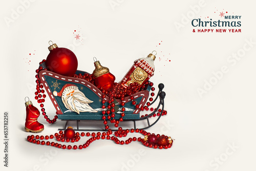 Wallpaper Mural New Year's Christmas decor sleigh with red Christmas tree toys on a white background isolated. Greeting card. Postcard for congratulations on the New Year and Christmas holiday. Torontodigital.ca